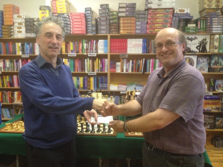 Malcolm Pein (left) receives cheque for £900 from organiser Andrew Farthing