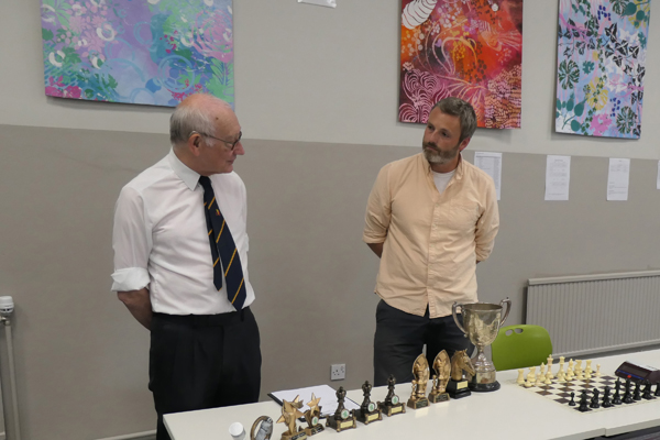 President and controller ionspect trophies before prize-giving