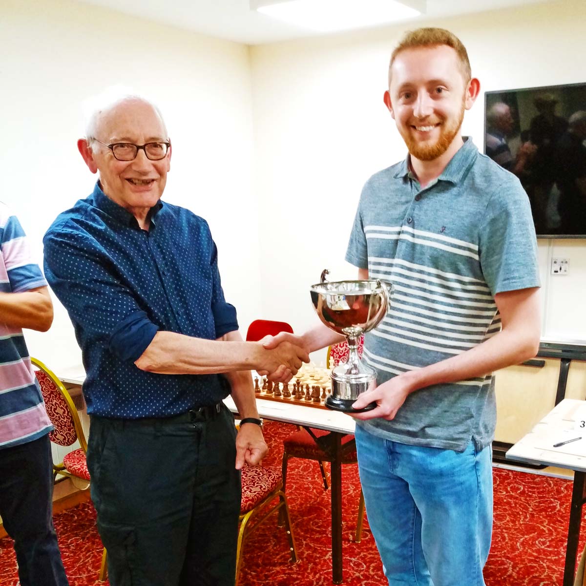 Joseph Friar receives the Bennett Cup from county president